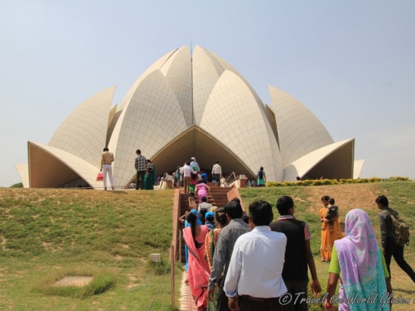 Waiting barefoot to enter the Lotus Temple