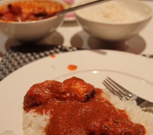 Butter Chicken – boneless pieces of chicken cooked with smooth tomato gravy and finished with butter and cream