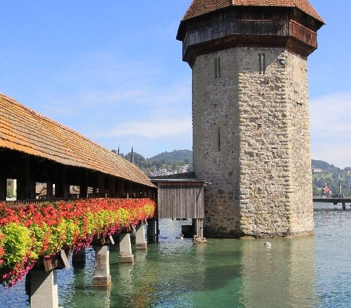 The gorgeous covered bridge in Lucerne with a beautiful backdrop